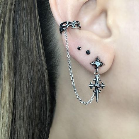 LISTING FOR 1 PIECE ONLY Gothic inspired Cross earring is attached with a chain to the Ear cuff.  Cuff part of the earring needs no piercing, just slide on the ear. This cuff fits both right and left ears.  Material:316 Stainless steel/ set with Black Cubic Zirconia stones Total earring length"  3 1/2"  Cuff :5.5 mm Cross stud:  25 mm *RETURNS / REFUNDS * -If you would like to return you purchase , please contact us within 7 days of receiving your package and we will accept the return.Return wil Gothic Ear Piercings, Ear Piercing Set Up, Goth Ear Piercings, Alt Earrings, Mens Earring, Cross Earring, Ear Piercing Jewelry, Goth Earrings, Pretty Jewelry Necklaces