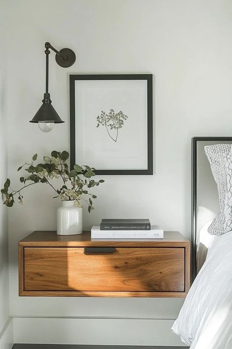 "Maximize space and style with floating nightstands! 🛏️✨ Perfect for creating a sleek, modern look in your bedroom. 🌟✨ #FloatingNightstand #BedroomDesign #SpaceSaving" Hanging Light Over Nightstand, Floating Nightstands Bedroom, One Nightstand Bedroom Layout, Bedroom Floating Nightstand, Floating Bedside Table Ideas, Floating Nightstand Bedroom, Floating Headboard With Nightstands, Small Nightstand Ideas, Small Bedroom Solutions