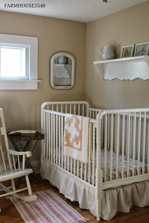 Farmhouse Nursery with white Jenny Lind spindle crib and neutral tan walls Vintage White Crib Nursery Ideas, Shaker Style Nursery, Primitive Nursery Ideas, White Jenny Lind Crib, Noras Nursery, Primitive Nursery, Baby Room Layout, Spindle Crib, Farmhouse Style Nursery