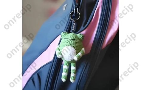 Difficulty level: easy With this description, you can crochet a frog keychain with long legs using the amigurumi technique. For the project, you’ll need YarnArt Jeans or similar semi-cotton yarn. The toy's eyes are closed and are embroidered with the… Crochet A Frog, Keychain Crochet Pattern, Frog Keychain, Amigurumi Keychain, Keychain Crochet, Crochet Amigurumi Free, A Frog, Crochet Keychain, Amigurumi Free