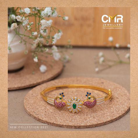 Peacocks have always been related to royalty. Such is the feeling one gets with this elaborate bracelet. Coming with a Cz floral design in the center, with dual peacock motifs on either side. Being decked with ruby and emerald adds a unique elegance to the piece. . . . #peacockcollection #chains #chaincollection #pendent #goldjewellery #stonejewellery #giftingjewellery #onlineshopping #Vizag #Tirupathi #Rajahmundry #Gajuwaka #Vizianagaram #Kakinada #Gopalapatnam #Srikakulam #Cmrjewellery Peacock Bracelet, Peacock Motifs, Gold Peacock, Bangles Jewelry Designs, Peacocks, Bangles Jewelry, Jewelry Designs, Gold Jewelry, Ruby