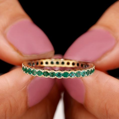 Product Details We know how Jewelry works charm for all our lovely ladies out there and so we bring this Gorgeous Eternity Ring for all our ladies who never go out of style. This Emerald Eternity Ring with Beaded Bezel Details is a must have Eternity Ring for all those special occasions, be it your Engagement, or a beautiful Valentine date night, this gemstone Ring will definitely charm everything up, so grab it now. Product Information SKU SHP-RINGS042165859 Width 1.8 mm Height 2.4 mm Weight 2. Emerald Stacking Ring, Emerald Ring Band, Valentine Date, Emerald Eternity Ring, Emerald Band Ring, Half Bezel Setting, Emerald Band, Jewelry Words, Full Eternity Ring