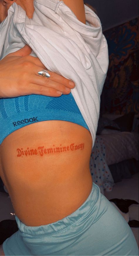 ribcage script tattoo Divine Feminine Energy Tattoo, Tattoo In Red Ink, Feminine Energy Tattoo, Energy Tattoo, Script Tattoo, Divine Feminine Energy, Tattoo Script, Red Ink, Rib Cage