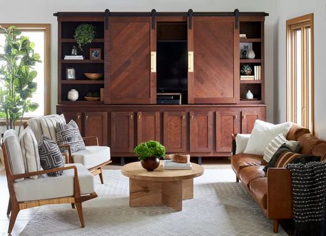 10 Clever Ways to Hide a TV in Plain Sight Tv Armoire Living Room, Hidden Tv Cabinets Built Ins, Hidden Tv Cabinet Ceiling, Hide Tv In Bookcase, Enclosed Tv Cabinet Hidden Tv Over Fireplace, Tv Unit With Hidden Door, Tv Barn Doors Hidden Tv, Unique Tv Stands, Family Room Storage