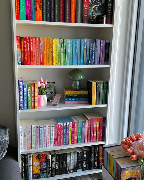 Updated bookshelf tour 🤍🫶🏻🌈 Qotd: what’s your favourite way to organize your books? (Author, colours, genre, vibes, chaos) ? I’ve added some little details over the last couple weeks and wanted to post an updated photo of my shelf 💓 Bookshelf is the “Billy bookcase” from @ikea - Fake long stem tulips from @amazon - fake flowers from @homesensecanada - ceramic mushroom from @homesensecanada - Tbr cart is from Michael’s - Lucien candle from @briarwick - Acowar mini keychain from @hand.... Update Bookshelf, Fake Flowers In Vase, Tbr Cart, Bookshelf Tour, Ceramic Mushroom, Mini Library, Bookish Stuff, Mini Keychain, Reading Aesthetic