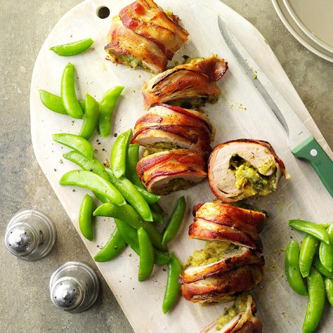 Bacon-Wrapped Pesto Pork Tenderloin Recipe -I love to serve this family-favorite tenderloin—maybe because of the compliments that come with it! When the weather warms up, we grill it instead. —Megan Riofski, Frankfort, Illinois Pesto Pork Tenderloin, Bacon Wrapped Recipes, Bacon Recipes For Dinner, Bacon Dinner, Breakfast Ingredients, Bacon Cheeseburger, Pork Tenderloin Recipes, Stuffed Pork Tenderloin, Bacon Recipes