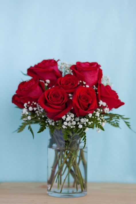 Red Quince Centerpieces Simple, Red Roses And Greenery Centerpiece, Red And White Flower Arrangements Simple, Red And White Roses Floral Arrangements, Red Flower Table Decorations, Red Rose Centerpieces Simple, Simple Red Rose Centerpiece, Simple Red Rose Bouquet, Red Roses With Baby Breath