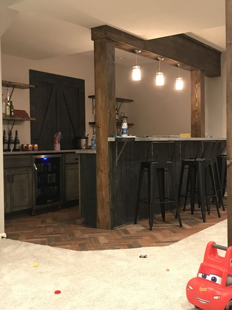 Basement bar Bar With Post, Basement Bar Between Columns, Basement Bar Table Ideas, Bar Between Columns, Double Sided Bar, Bar Island Ideas, Rustic Modern Bar, Basement Bars, Basement Bar Plans