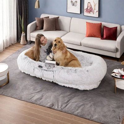 The human dog bed features plush materials, supportive bolsters and a non-slip plastic bottom. It only takes a few steps to complete the cleaning, and low temperature machine washing is recommended. Perfect for napping or sleeping, its versatile design adds a cozy touch to any room. Tucker Murphy Pet™ | Tucker Murphy Pet™ Washable 71" Faux Fur Human Dog Bed w/ A Strap, Giant Dog Bed For Humans, Faux Leather | C111816075 | Wayfair Canada Giant Dog Bed For Humans, Giant Dog Bed, Dog Bed For Humans, Giant Dog Beds, Human Dog Bed, Human Dog, Giant Dogs, Mudroom Furniture, Game Room Furniture