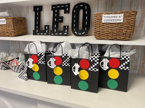 Gift bag perfect for Race Car  or Cars Theme Birthday Parties. They make a perfect gift bag for the little cars racers. They are personalized for each little guest.  Provide Age of Birthday for the age number cutout.  Color - Black Details Material: Paper Bag Size : 7.875 inches x 10.25in x 4.25in LISTING IS FOR Bag ONLY - NO OTHER ITEMS WILL BE SHIPPED. Two Fast Birthday Favor Bags, Traffic Birthday Party, Car Themed Birthday Party Goodie Bags, Retro Car Themed Birthday Party, Car Theme Return Gifts, 2 Fast 2 Furious Party Favors, Traffic Light Birthday Party, 2 Fast 2 Curious Birthday Party Favors, Race Car Themed 3rd Birthday Party