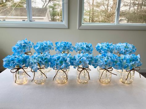 Light up your wedding, parties or events! Included is a package of 12 lighted mason jars with twine and hydrangeas. We can do color ribbon instead of twine if you would like.. Just message us with your request. There is 6 quart lighted jars and 6 pint lighted jars in this listing. The lights last 72 hours and a screwdriver is included to change batteries when needed. These lighted jars receive many compliments from guests. You can mix hydrangea colors also.. Just leave a note to seller at checko Lighted Wedding Centerpieces, Mason Jars With Twine, Lighted Mason Jars, Budget Friendly Wedding Centerpieces, Jar Centerpiece Wedding, Blue Hydrangea Wedding, Baby Blue Weddings, Wedding Centerpieces Mason Jars, Mason Jar Centerpiece