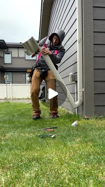 thesidingguy on Instagram: "I was hired to replace this missing kick-down extension.  There are many ways to do kick downs, but I had to match all of the other kick downs around the property, so this is how I did it.

These stay down all the time, and they lift up for when you mow the lawn.  Why aren’t these routed underground?  Our city has bylaws regarding which areas can be routed underground.  Many neighbourhoods have to have all surface drainage, so the extension brings the water away from the house to the swale line which typically runs on the property lines of houses. 

I hope this video was informative to you.  Thanks for watching.
.
.
.
.
.
.
.
.
.
.
.
.
.
#eavestrough #gutters #downspouts #aluminumeaves #aluminumdownspouts #raingutter #residentialconstruction #diy #repair" Gutter Drainage Ideas, Gutters On House, Underground Gutter Drainage, Gutter Downspout Extension, Foundation Drainage, Gutter Drainage, Surface Drainage, Gutters And Downspouts, Backyard Drainage