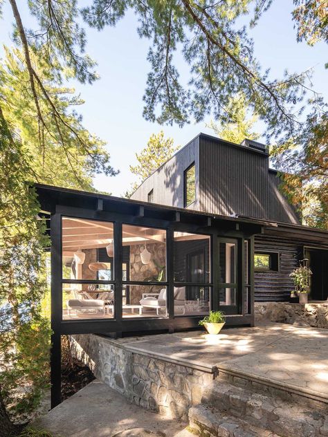 A Black Exterior And New Living Spaces Were Part Of Remodeling An Old Log Cabin Into A Contemporary Home Stone Fireplace Surround, Contemporary Cabin, Small Log Cabin, Rustic Log Cabin, New Staircase, Cottage Renovation, Timber Beams, Old Cottage, Lake Cottage