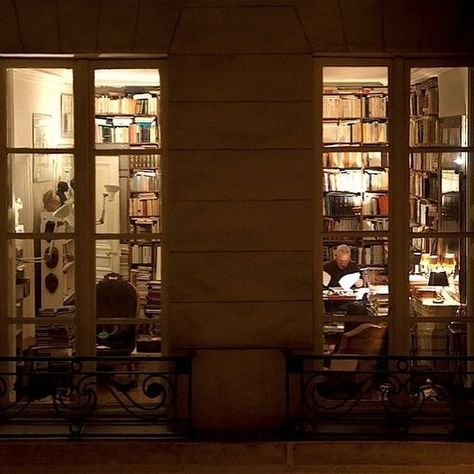 writer at home peering into a window at dusk Apartment At Night, Dusk Aesthetic, Pretty Library, Dreamy Apartment, Night Window, Film Locations, Library Room, New York Apartment, Beautiful Spaces