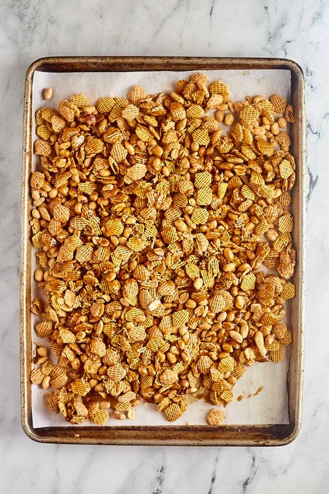 This caramel Crispix mix features peanuts and cereal in a crispy caramel coating. It is kind of like caramel corn, but made with cereal instead of popcorn. This microwave recipe makes getting that crispy finish even faster and easier. You have to try this fun sweet and salty snack. Crispix Cereal Recipes Snacks, Sweet Cereal Mix Recipes, Cereal Recipes Snacks, Caramel Cornflakes, Crispix Cereal, Crunchy Caramel, Microwave Recipe, Cereal Mix, Cereal Snacks