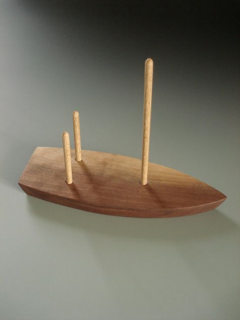 This is a simple design for keeping some napkins at the ready. The boat is of walnut wood finished with mineral oil and beeswax. The masts are wooden dowel rods. The boat measures about 8 long and 3 wide. The top of the mast is 6 from the table. The boat will be shipped flat with the Diy Napkin Holder, Wood Art Projects, Small Woodworking Projects, Wall Decor Ideas, Crafts Home, Open Studio, Wooden Projects, Décor Diy, Napkin Holder