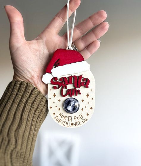 Adorable Santa Cam added to the shop! Keep your kids on their best behavior this holiday season. Santa Camera, Santa Cam Ornament, Santa Cam, Spy Cam, Baby And Mom, Laser Files, Gifts For Baby, Holiday Items, Special Deals