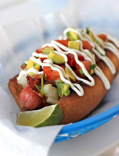 You've heard of Chicago Dogs, New York Dogs, Dodger Dogs, and Kansas City BBQ Dogs... well, let me introduce you to the dog that will top them all, Tucson's very own Sonoran Dog. Sonoran Hot Dog Recipe, Sonoran Dogs, Sonoran Hot Dog, Tuscon Arizona, Dodger Dog, Bacon Wrapped Hotdogs, Hand Wrapping, Hot Dog Toppings, Magazine Feature