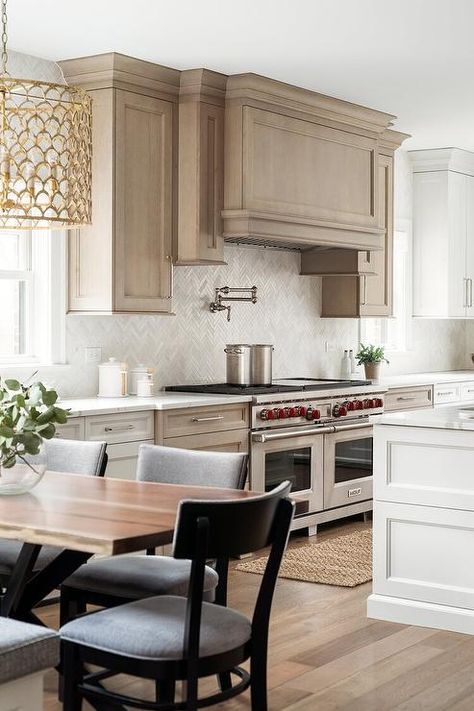 Oak Range Hood, Light Brown Kitchen Cabinets, Light Brown Kitchen, White Herringbone Backsplash, White Herringbone Tile, White Oak Kitchen, Transitional Kitchen Design, White Kitchen Island, Oak Kitchen Cabinets