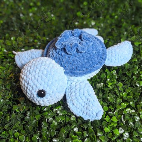 "THIS LISTING IS READY TO SHIP! Made with ultra-soft yarn, this turtle is sure to be a hit with your plushie lover! Each turtle comes with a customized name card, stating the date it was created as well as its own unique name. If you would like your turtle to have a specific name, please let me know in the personalization box! Note: Each item is crafted by hand, one-by-one, so some slight variations are expected from one toy to the next.  ⚠ WARNING ⚠ Choking Hazard - This toy contains safety eyes, which present a choking hazard to young children. This product is not advised for children under 3 years of age. Turtle Details ------------------ Yarn: 100% Polyester Stuffing: Polyfill Contains: Safety Eyes Color: Light blue body with a darker blue shell, with blue glitter safety eyes Sizes & A Blue Crochet Plushies, Turtle Stuffed Animal, Crochet Turtle Pattern, Magic Crochet, Easy Crochet Animals, Eyes Color, Blue Crafts, Crochet Turtle, Unique Name