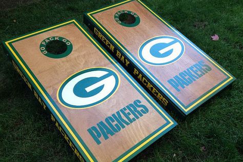 Green Bay Packers on stained wood Cornhole by Cornholetherapy Green Bay Packers Cornhole Boards, Packers Cornhole Boards, Football Cornhole Boards, Green Bay Packers Funny, Cornhole Board Designs, Green Bay Packers Crafts, Packers Funny, Beanbag Toss, Bean Bag Boards