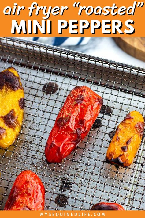 An assortment of mini peppers on an air fryer basket with roasted, blistered skin. Air Fryer Mini Peppers, Roasted Peppers In Air Fryer, Roasted Mini Peppers, Skin Blisters, Onion Grilled Cheese, Mini Peppers, Roasted Poblano Peppers, Long Pepper, Mini Sweet Peppers