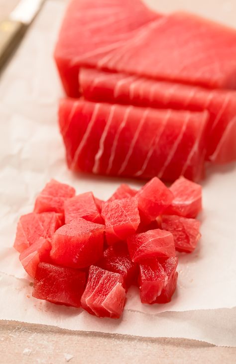 Angled photo of a raw sushi-grade tuna filet partially cut into cubes. Salad Recipes Lettuce, Tuna Poke Salad, Easy Salad Recipes Lettuce, Salad Recipes Easy, Salad Bowl Recipes, Poke Salad, Raw Tuna, Tuna Sashimi, Tuna Poke