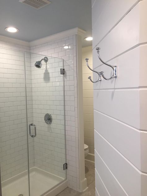 Tongue and groove wall with Pottery Barn robe hooks; and the subway tiled shower with frameless glass enclosure. Notice the pale blue ceiling, which connects this master bath to the master bedroom color, and lovely white crown molding. Shower With Crown Molding, Shower Tile To Ceiling Crown Molding, Crown Molding In Bathroom With Tile, Shower Crown Molding, Crown Molding In Bathroom, Bathroom Molding, Molding Bathroom, Crown Molding Bathroom, Bathroom Crown Molding