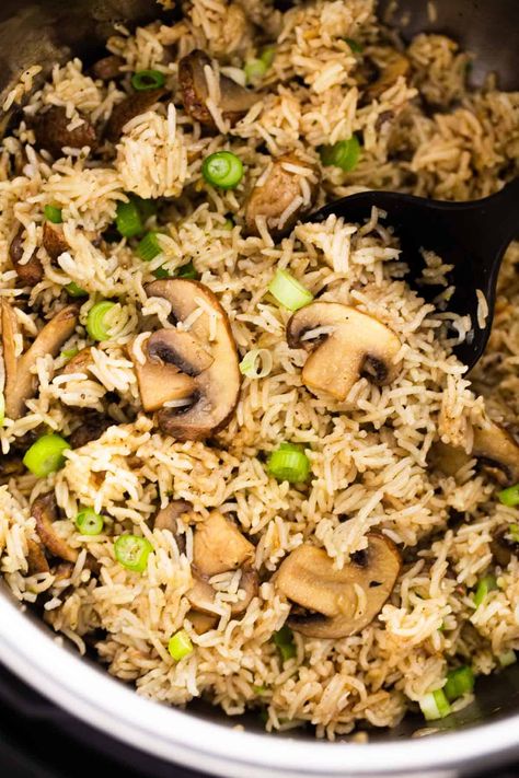 Mushroom rice in the instant pot with a serving spoon Savoury Rice Recipe, Rice In The Instant Pot, Mushroom Rice Recipes, Multi Cooker Recipes, Instant Pot Yogurt, Vegan Instant Pot Recipes, Delicious Rice, Mushroom Rice, Savory Rice