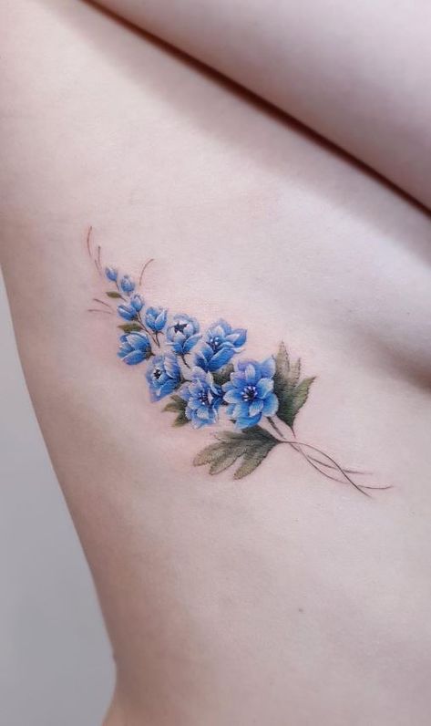 Delphinium Tattoo Simple, Larkspur And Bee Tattoo, Larkspur And Rose Flower Tattoo, Daffodil Larkspur Tattoo, Blue Flower Tattoo Designs, Larkspur Black And White Tattoo, Larkspur Ankle Tattoo, Blue Larkspur Tattoo, Delphium Flower Tattoo