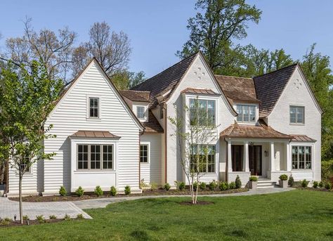 This home seamlessly blends the romanticism of a Tudor home with clean transitional lines, characterized by painted brick, pitched roof lines, and copper metal roofs. Copper Metal Roof, W Design Collective, Tudor Home, Tudor Style Homes, W Design, Tudor House, Tudor Style, Painted Brick, Architect House