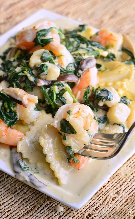 Ravioli with Seafood, Spinach & Mushrooms in Garlic Cream Sauce. Phenomenal but easy dinner to impress someone special in your life. Three cheese ravioli cooked in garlic cream sauce with shrimp, scallops, spinach and shiitake mushrooms. | from willcookforsmiles.com Easy Dinner To Impress, Dinner To Impress, Pasta Photography, Recipes Seafood, Shrimp Scallops, Garlic Cream Sauce, Cheese Ravioli, Shiitake Mushrooms, Photo Food