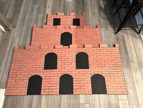 Making Bowser’s Castle – Part 2 – Florida Life with Laura Diy Mario Castle Cardboard, Bowser Castle Background, Super Mario Castle Diy, Diy Bowsers Castle, Diy Super Mario Backdrop, Bowser Trunk Or Treat Ideas, Mario Castle Diy, Bowser Castle Diy, Mario Pipe Diy