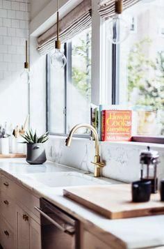 Love the marble backsplash behind the sink, brass fixtures and industrial bare bulb pendant lights hanging above! Such a pretty mix! Pretty Kitchen, Classic Kitchen, Kitchen Farmhouse, Kitchen Window, Counter Tops, Beautiful Kitchens, Kitchen Space, Dream Kitchen, Window Sill