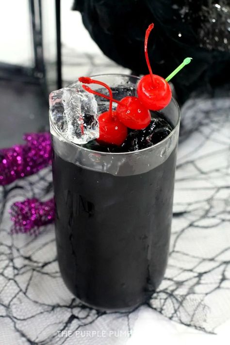 This jet-black Raven Cocktail is made with Jägermeister and rum and is a fantastic drink to serve at Halloween parties! #HalloweenCocktails #ThePurplePumpkinBlog Black Colored Drinks, Purple Rum Cocktail, Black Cocktails For Halloween, Black Drink Aesthetic, Black Halloween Cocktails, Black Mixed Drinks, Black Cocktail Drink, Black Drinks Cocktails, Raven Cocktail