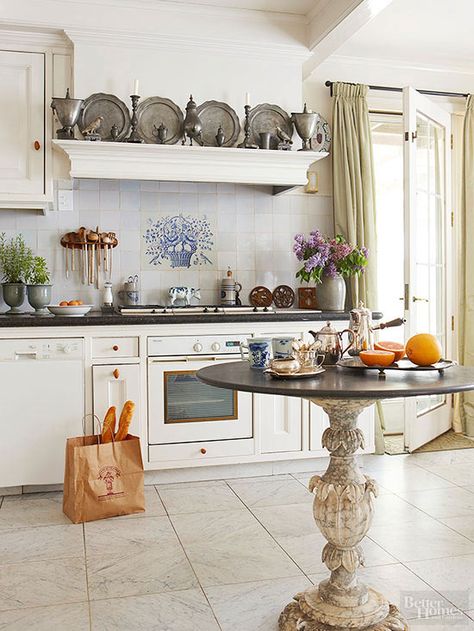 A Dutch native with a penchant for French designs created this distinctive, and highly personal, kitchen. Blue Frisian tiles, marble floors, and a salvaged mantel shelf tie the kitchen to the homeowner's homeland. French Kitchen Design, French Inspired Kitchen, French Kitchens, Parisian Kitchen, Kitchen French, Kitchen Ikea, Kitchen Design Pictures, Marble Floors, French Country Kitchens