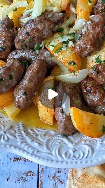 Taghrid Ahmad on Instagram: "Kafta & Potato bake in a garlic lemon dressing 😋 a different way to make your Kafta bake, my mum use to make this for us as kids & serve it with fresh pita & a salad. What you may think is an odd combo it’s actually quite delicious! Have you had it this way before ? RECIPE ⬇️ Kafta & Potatoes in Garlic Lemon Dressing 1.5kg Kafta moulded into oval Patties (I used store bought from @akarmeatsmerrylands - see below for Kafta recipe if you wish to make your own) 4 large potatoes cut into wedges 8 garlic cloves 1 sliced onion 1/2 cup lemon juice 1/4 cup olive oil 1/4 cup water Salt & cracked black pepper Line your Kafta in an oven dish, add a sliced onion ontop & semi bake at 180c for approx 20 minutes, in the meantime season potatoes with salt & also sem Kafta Recipe, Season Potatoes, Pomegranate Sauce, Sliced Onion, Seasoned Potatoes, Potato Bake, Middle Eastern Dishes, Oven Dishes, Lemon Dress