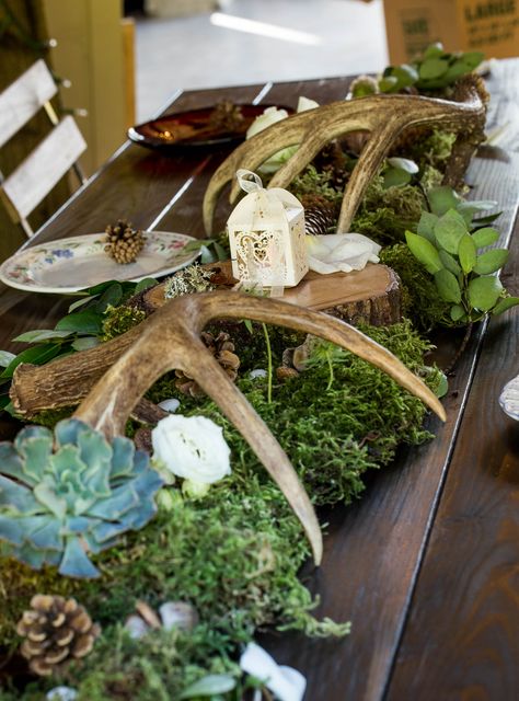 Deer themed barn wedding. Antlers, succulents, pine cones, moss, white roses. Sidetrack Distillery, Kent, WA. Deer Horn Wedding Decor, Deer Antler Table Decor, Antler Wedding Decor, Woodland Reception, Camp Decorations, Moss Centerpieces, Hunting Wedding, Deer Wedding, Antler Wedding