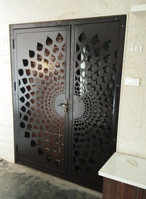 10 Latest Safety Door Design With Pictures In 2022 Sefty Door Design Entrance Metal, Safety Gate For Main Door, Metal Safety Door Design, Safety Grill Door Design, Mandir Gate Design, Safety Door Design Entrance Grill, Cnc Door Design Modern, Safety Gate Design, Gates Sliding