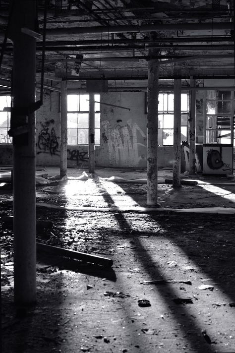 An abandoned mill with light coming in through the window and creating long shadows. Forgotten Things Photography, Black And White Abandoned Places, Urban Photography Black And White, Black And White Industrial Photography, Abandoned Place Aesthetic, Abandoned Urban Places, Abandoned Buildings Photography, Spaces And Places Photography, Industrial Aesthetic Photography