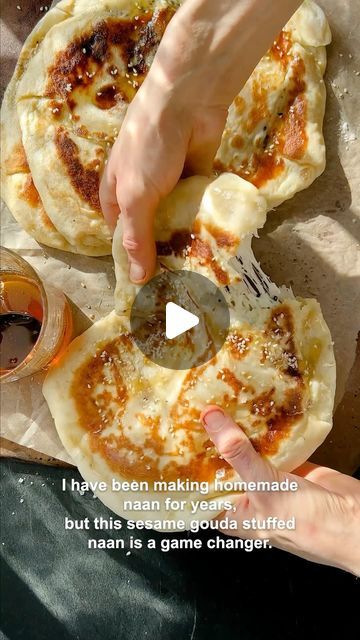 Tieghan Gerard on Instagram: "Sesame Gouda Stuffed Naan with sweet honey. This is what your weekend needs the most. Cheesy Naan. It’s extra soft, doughy, chewy, and stuffed with creamy, melty gouda cheese + sesame seeds…YUMMMY (: 2 teaspoons honey 2 1/4 teaspoons active dry yeast 1 cup full fat plain greek yogurt 4 cups all-purpose flour 1 1/2 teaspoons baking powder 1 teaspoon baking soda 1/2 teaspoon kosher salt 4 cups shredded gouda cheese 3 tablespoons white sesame seeds2 tablespoons black sesame seeds 6 tablespoons salted butter melted honey for serving https://www.halfbakedharvest.com/sesame-gouda-stuffed-naan/" Cheesy Naan, Stuffed Naan, Fried Bread Recipe, Tieghan Gerard, Half Baked Harvest Recipes, Active Dry Yeast, Naan Recipe, Gouda Cheese, Black Sesame Seeds