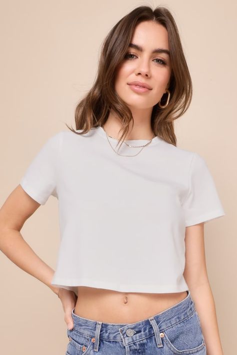 Spicing up your everyday wardrobe is easy when you have the Lulus Casual Thrills White Cutout Tie-Back Short Sleeve Crop Top! Cotton-blend stretch knit shapes this must-have tee with a classic crew neckline framed by short sleeves. Relaxed, boxy bodice features a cutout at the back with a cute tying detail in the middle. Pair with your favorite denim for a casually flirty look! Fit: This garment fits true to size. Length: Size medium Bust: Great for any cup size. Waist: Loosely Fitted. Undergarm Loose Crop Top, Crop Top Short Sleeve, Cropped White Tee, Casual Formal Dresses, Short Sleeve Crop Top, Lulu Fashion, Crop Top Casual, Casual Wedding Dress, Small Crop Tops