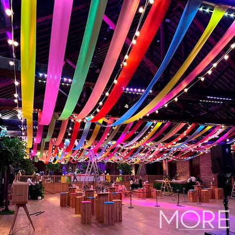 Carnival Lights Decoration, Streamers Across Ceiling, Colorful Event Design, Ceiling Party Decor Ideas, Cool Things To Hang From The Ceiling, Streamer Decorations Ceiling, Ceiling Streamers Ideas, Streamer Ceiling Decorations, Ceiling Event Decor