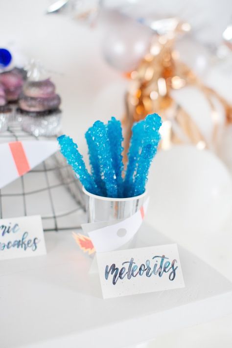 This outer space party was jam packed with cute details. From the hand painted aqua, orange and silver punny food labels to the custom rocket ship invitation featuring a GIRL astronaut. https://olivefoxdesign.com/spacedetails/ #outerspaceparty #eventplanning #calligraphy Out Of This World Party, Out Of This World Birthday Party, Space Party Food, Galaxy Birthday, Galaxy Party, Sun Birthday, Astronaut Party, Space Food, Boys First Birthday Party Ideas