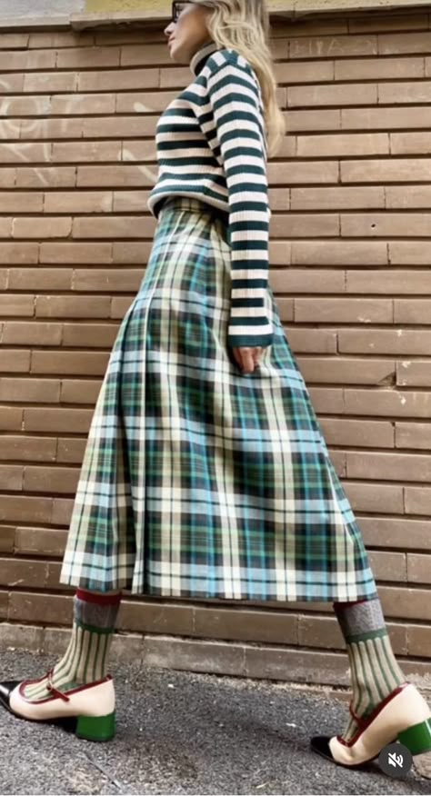 Mix Match Pattern Outfits, Mismatched Patterns Outfits, European Fall Fashion Street Style, Green Tartan Skirt Outfit, Tartan Midi Skirt Outfit, Mixed Prints Outfit Street Style, Skirt Trends 2024, Clashing Patterns Outfits, Pattern Clashing Outfits