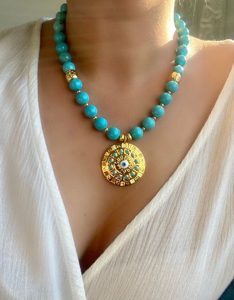 #etsy: Genuine Turquoise Necklace,Beaded Turquoise and Evil Eye Gold Medallion Necklace,Eyecatching Gemstone Summer Jewelry,https://etsy.me/46LlZ4z #genuineturquoisenecklace #goldbluemedallion #bigboldbeadednecklace #gemstonejewelry #bluenecklace #statementnecklace Turquoise Jewelry Necklace Gold, Big Pendant Necklace, Chunky Turquoise Necklace, Gold Medallion Necklace, Pearl Neck, Necklace Evil Eye, Jewerly Beads, Unique Birthday Gift, Gold Medallion