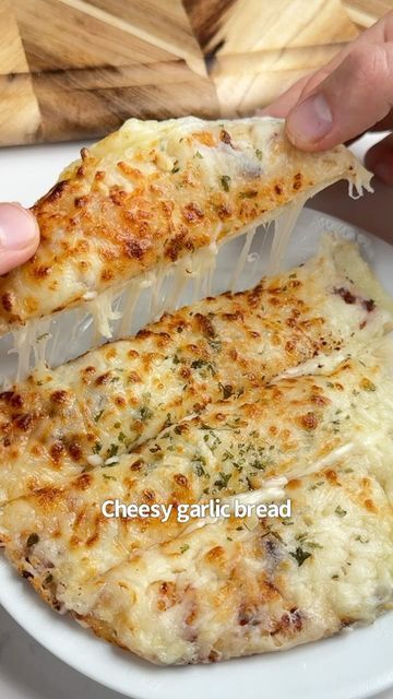 iRick Wiggins on Instagram: "Say “YUM” if you would eat this Cheesy Garlic Bread 🥖😋🙌

What you need:
2 low carb tortillas
2 oz cream cheese
1/2 cup shredded mozzarella 
2 tbsp melted butter 
1 tsp garlic, minced
1 tsp chopped parsley 

How to make it:
1. Spread your cream cheese on a tortilla and add half of your mozzarella. Top with the other tortilla.
2. Mix the butter, garlic & parsley and brush on each side of the tortillas.
3. Add your final layer of mozzarella to the top & air fry @ 380F for 8-10 mins.
4. Take it out, serve with more garlic butter and enjoy!" Cheesy Garlic Bread In Air Fryer, Cheesy Garlic Tortilla, Garlic Bagels, Irick Wiggins, Garlic Rolls, Cream Cheese Bread, Clean Eating Guide, Garlic Cheese Bread, Homemade Granola Bars