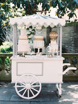 Wedding reception Paris theme dessert pastry cart with three cakes and macaron sphere with pastries Dressing Stand, Wedding Bar Cart, Dessert Cart, Gerobak Dorong, Display Tables, Paris Flowers, Sweet Carts, Parisian Wedding, Sweet Tables