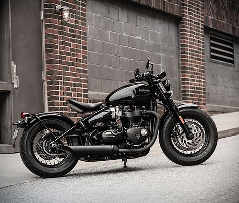 Triumph has just revealed the Bobber Black, a darker, meaner and stronger version of their popular Bonneville Bobber, the fastest-selling Triumph ever produced. The blacked out version is more than just a new color option, as Triumph has added a fat Triumph Bonneville Bobber, Bonneville Bobber, Ducati Monster 1100, Motor Harley Davidson, Motos Bobber, Motor Balap, Moto Triumph, Triumph Rocket, Retro Bikes