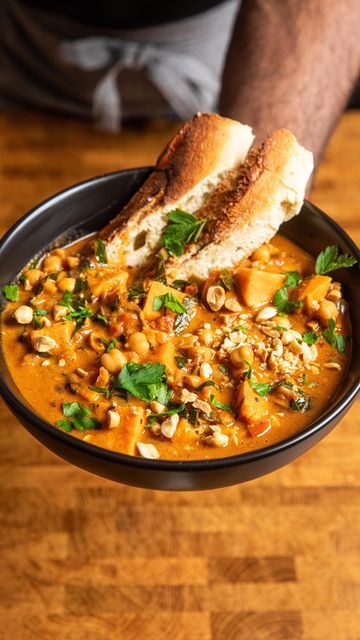 Andrew Bernard on Instagram: "Click here!! This recipe is in my IG profile bio!   This West African Peanut Stew has so much flavor people will think you got it from a restaurant!  Easy to make, loaded with veggies, perfect for cold days and meal prep!  Ingredients:  -onion -bell pepper -garlic -ginger -sweet potatoes -peanuts -chickpeas -fire roasted tomatoes -stock -peanut butter -serrano pepper -leafy greens -tomato paste -spices  Full recipe in the bio links or get the recipe by searching “peanut stew” at makeitdairyfree.com https://makeitdairyfree.com/one-pot-west-african-peanut-stew-vegan/   #mealprep #soup #souplover #vegansoup #soupseason #stew #wfpb #eatyourveggies  #musttryfood #meatlessmondays #vegan  #veganrecipes #plantbasedrecipe #easymeal #easyrecipe #recipevideo #blackmencoo Andrew Bernard, West African Peanut Stew, Peanut Stew Vegan, Meal Prep Ingredients, Chilli Soup, Stew Vegan, African Peanut Stew, Vegan Chilli, Peanut Stew